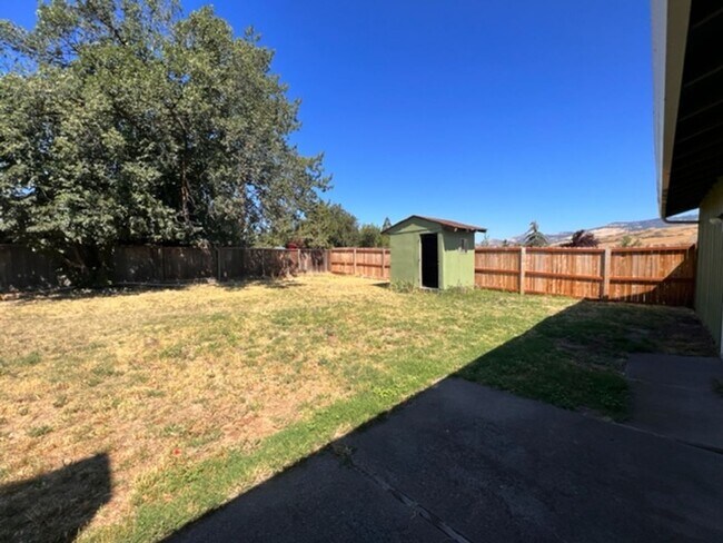 Building Photo - Three bedroom home with large yard| Available July!