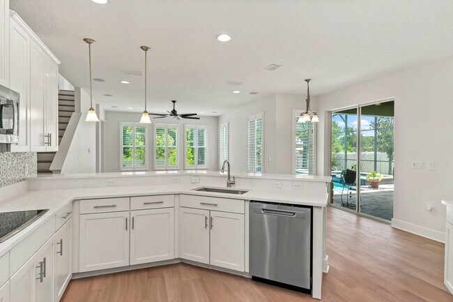 Building Photo - Expansive 4 bedroom, 3 bath remodeled home in gated community