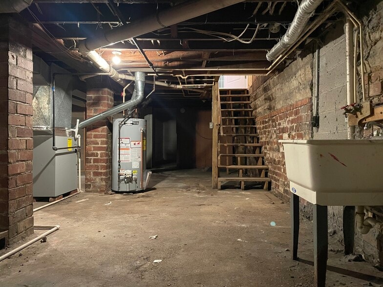 Full basement with washer/dryer hookup. - 117 W Oak St
