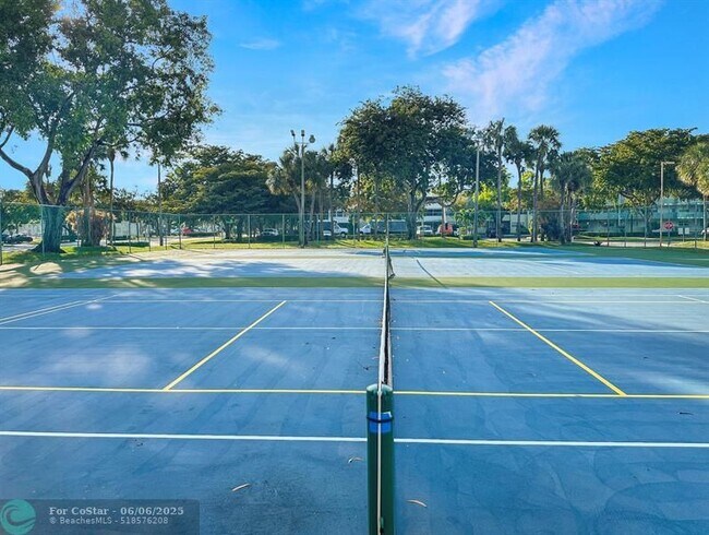Building Photo - 6090 N Sabal Palm Blvd