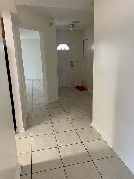 Entrance hallway leads to a split-bedroom layout, offering privacy and separation for family or gues - 5374 Lacy Jane Way
