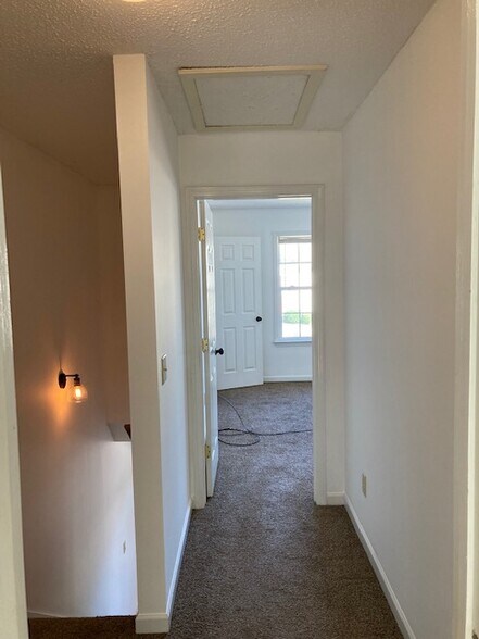 hallway to bedroom - 633 Wilderness Trl