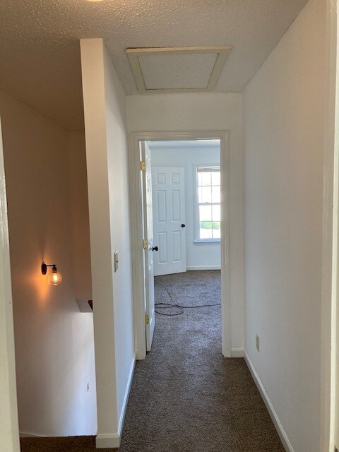 hallway to bedroom - 633 Wilderness Trl