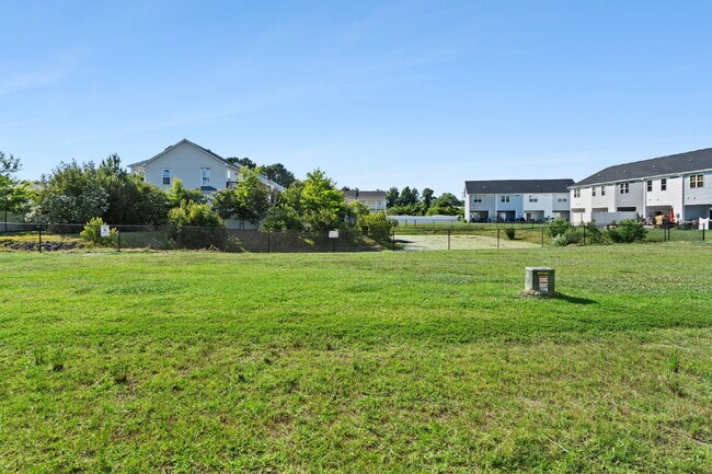 Building Photo - Available Now! Enjoy low-maintenance coastal living in this beautiful 2-bedroom, 2.5-bath townhom...