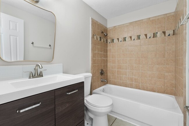 Building Photo - Fully Renovated 3BR/2BA Condo with Private Fenced Yard – Prime Location Near Oaks Mall & I-75