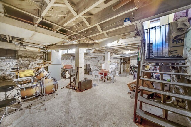 Building Photo - Charming 5-Bedroom Home with Exposed Brick and Modern Upgrades