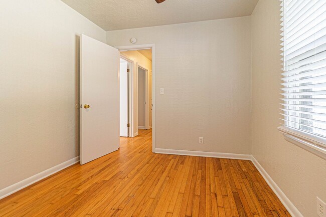 Building Photo - Three Bedroom Home in tree filled neighborhood! Lawn care included!