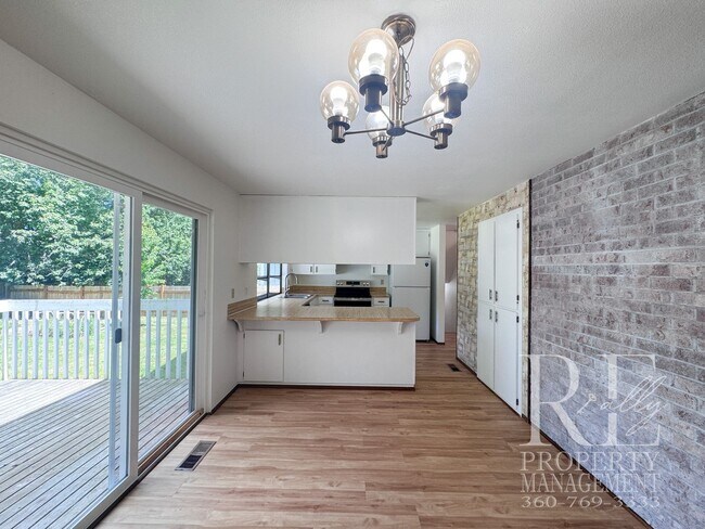 Building Photo - Spacious Poulsbo Home with Large Basement, Fenced Yard & Garden Space