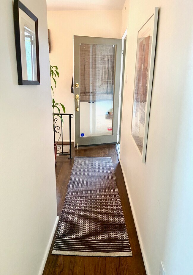 Hallway leading to the peaceful lower level, separated from the main living areas. - 1672 Rotary Dr