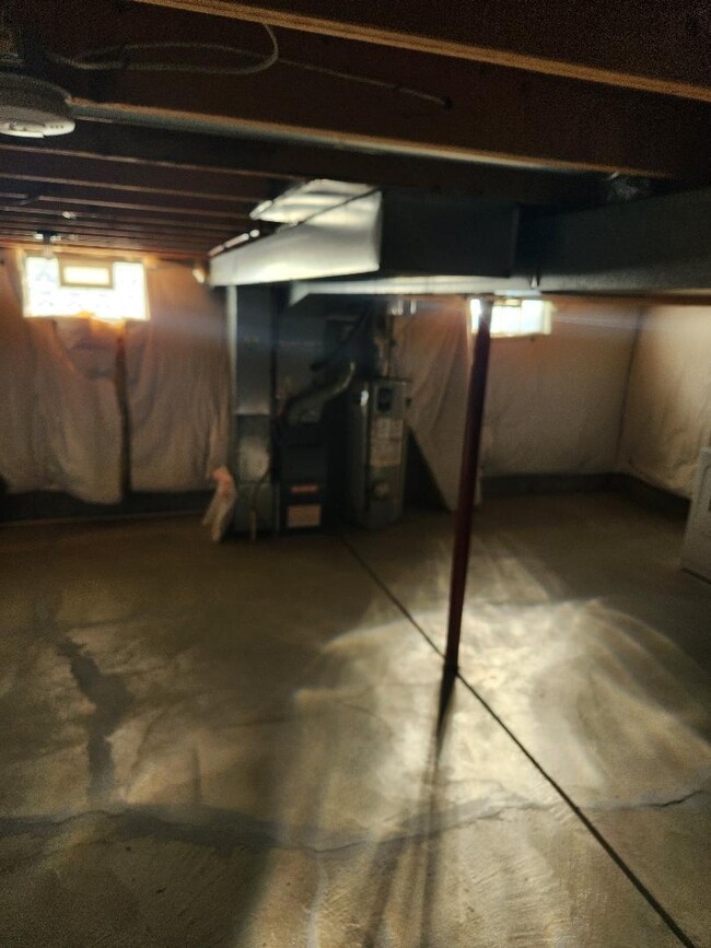 Full basement with washer and dryer. - 6568 Ward Rd