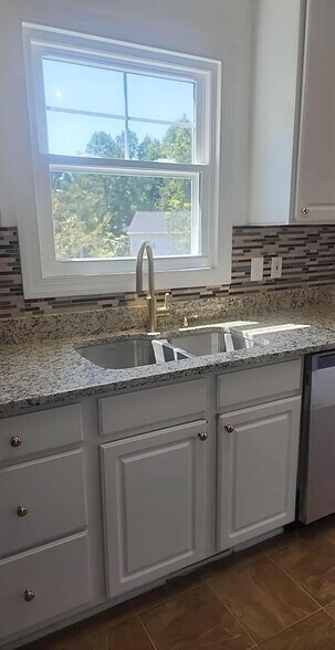 New gold faucet - 837 Shackleton Rd