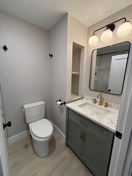 Brightly lit bathroom with storage - 2026 Lombard Ave