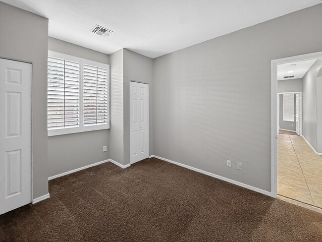 Building Photo - Single-level 4 bed, 2 bath home with tandem 3-car garage and RV gate.