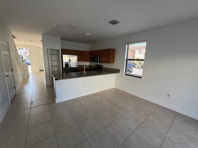 Building Photo - 9399 W 33rd Ln