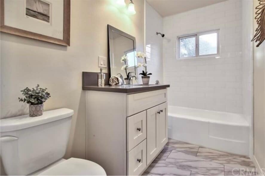 Guest bath with modern vanity and subway tile shower, near two guest bedrooms - 332 E Deodar St