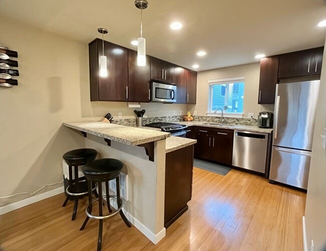 Building Photo - Stylish Greenwood Townhome with Private Patio & Modern Finishes