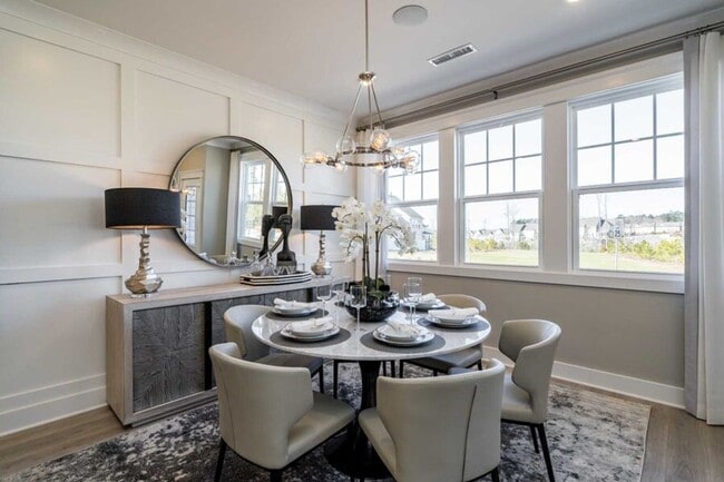 Building Photo - 3 Bedroom 2.5 Bathroom End Unit Townhome w/ 1st Floor Owners Suite and a 2 car Garage in the hear...