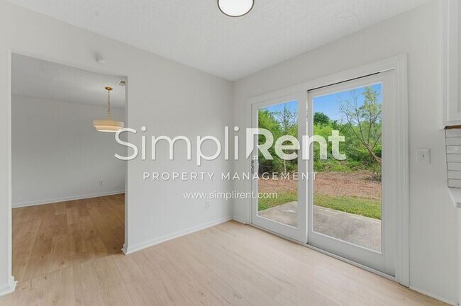 Building Photo - Updated Home with Spacious Layout & Private Backyard