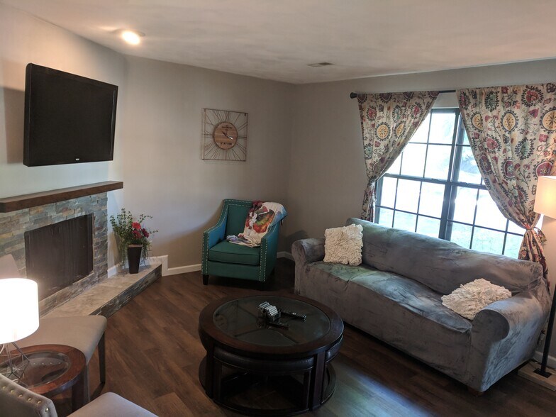 Living Room with Wood Burning Fireplace - 833 Nowland Ct