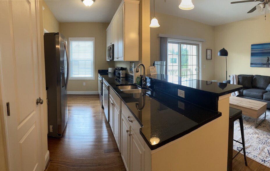 Fully equipped kitchen, includes pantry and separate laundry closet. Electric stove, dishwasher, lar - 123 Covil Ave