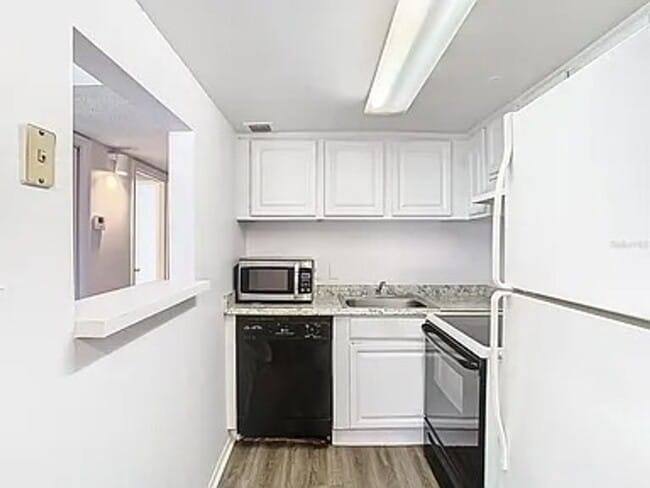 Building Photo - 2BR Condo Near UCF – All-Inclusive Living & Resort Amenities!