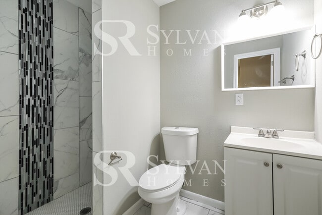 Building Photo - Feel welcome in this well-maintained 4BR 2...