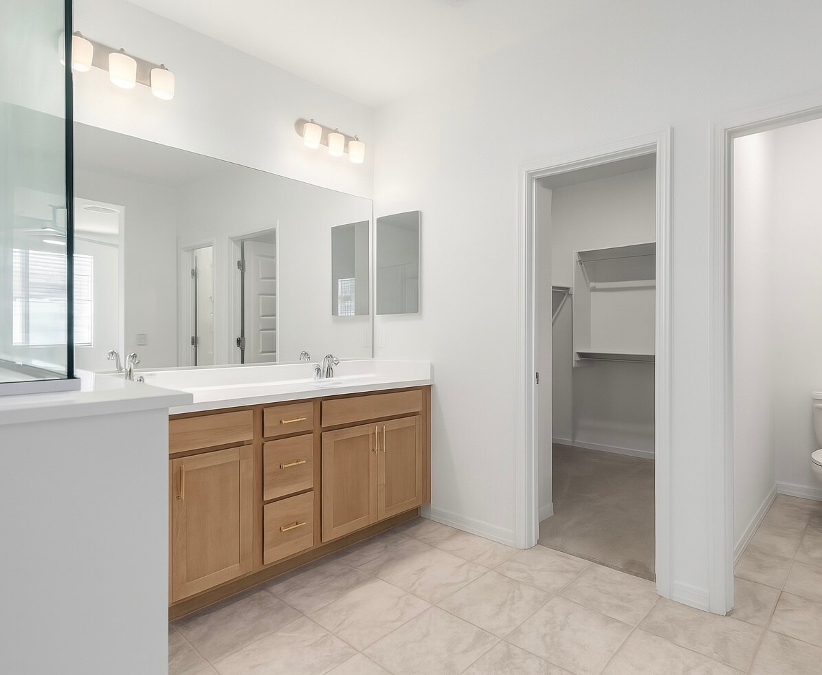 Master bath and walk-in closet - 10223 W Piccadilly Rd