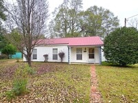 Building Photo - Rent Includes ALL utilities, yard maintenance and Wifi