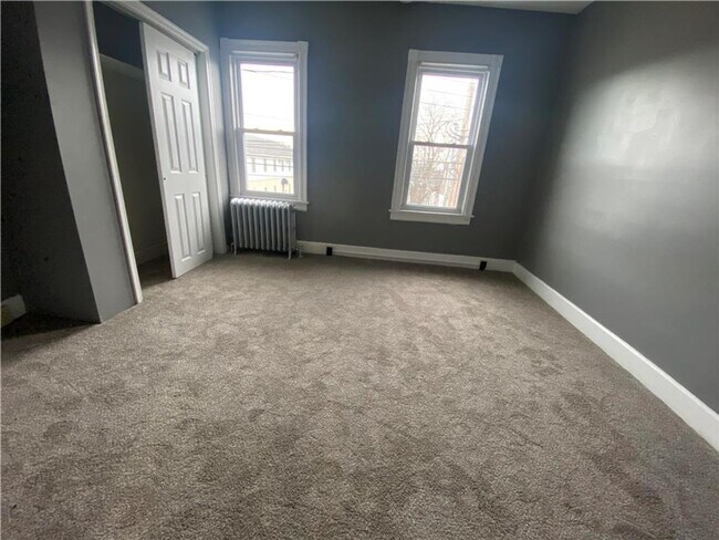 Building Photo - Charming three-bedroom row house available...