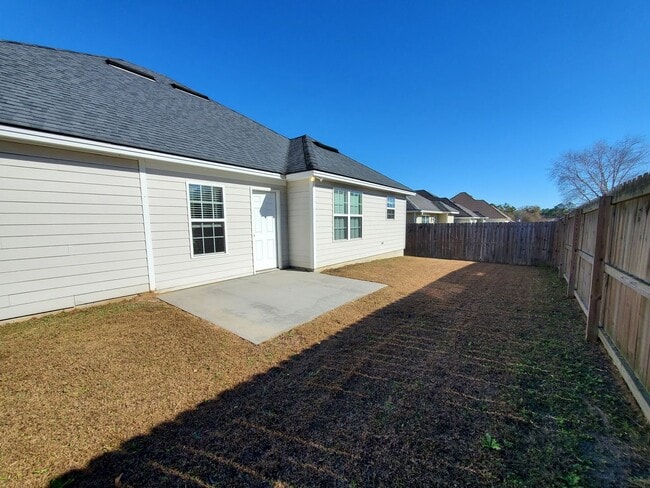 Building Photo - Spacious 4-Bedroom Home with Open Layout, Granite Finishes & Fenced Yard