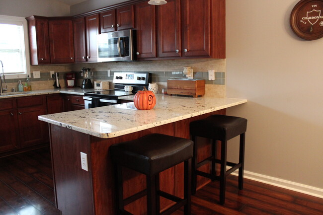 Granite Bar for Prep and Extra Seating - 2629 Whiteberry Dr