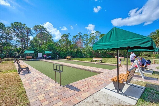 Building Photo - Elegant 3 Bedroom End-Unit Condo with Screened Lanai & Pond Views and A Private Garage