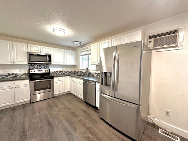 Building Photo - Three bedroom home with large fenced yard