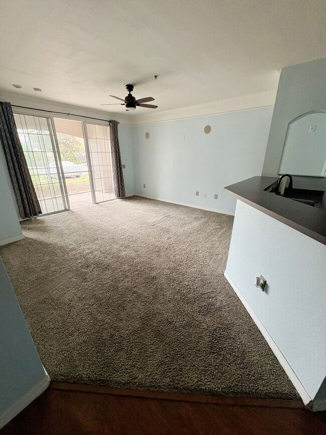 Building Photo - AVAILABLE NOW: First-floor 2-bedroom, 1-bath condo in Gated Community