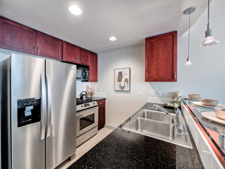 Premium stainless steel appliances and ample cupboard storage for the urban chef's space - 2929 1st Ave