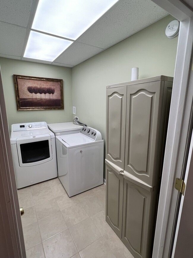 Laundry room with storage. - 3617 Sunset Rdg