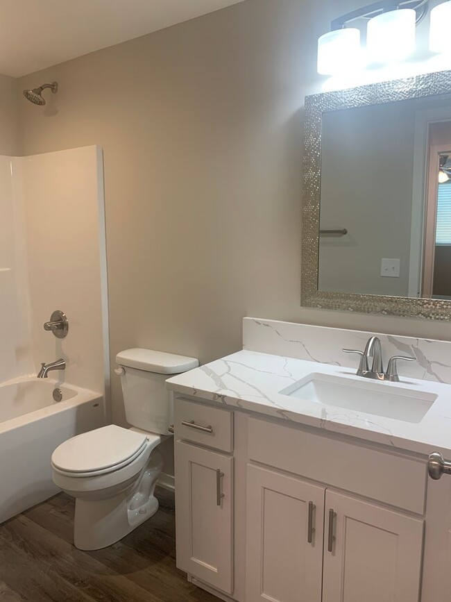 Building Photo - Walkout ranch townhome with 2 stall garage...
