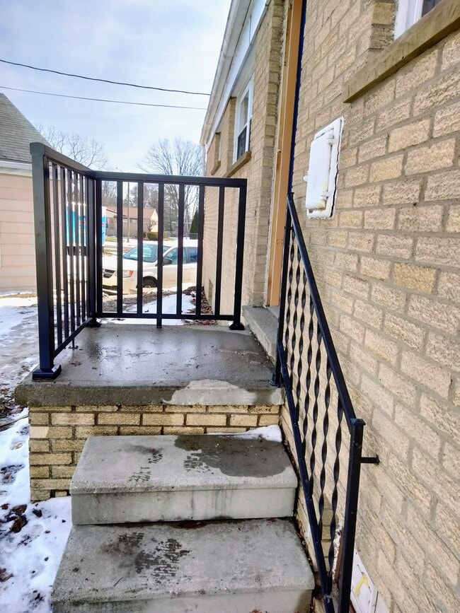 Back steps with new railing - 1004 Gould Rd