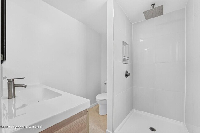 Building Photo - Welcome to this beautifully remodeled 4-bedroom, 3-bath home in the heart of Indialantic Beach!