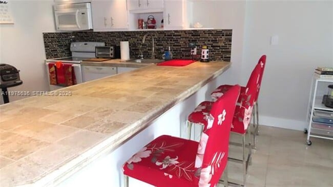 Building Photo - 5701 Collins Ave