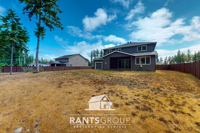 Building Photo - Luxury 4-Bedroom Home with 5-Car Garage & ...