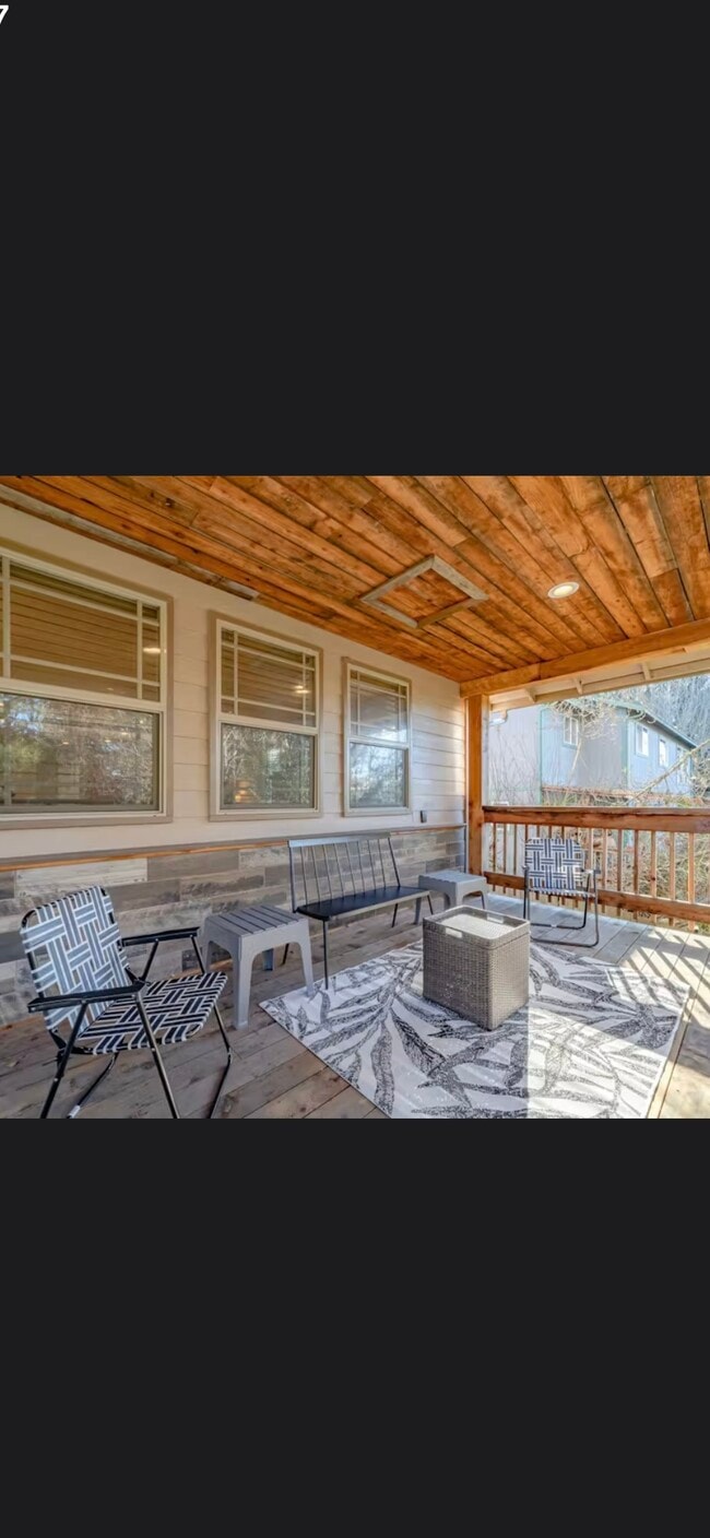 Wrap around porch that looks into green space - 4156 Williams St