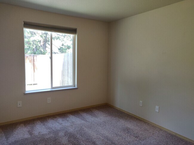 Building Photo - Charming 4-Bedroom Home on 1/2 Acre with a Fenced Backyard, Fully Insulated Double-Car Garage, in...
