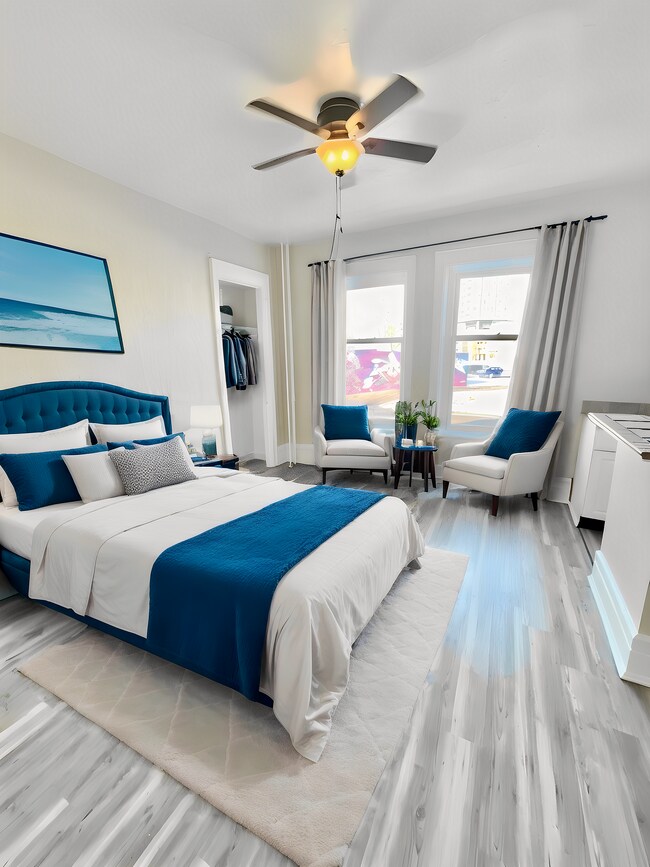 Immerse yourself in the tranquility of this chic urban bedroom, perfect for comfort and relaxation. - Cross Apartments