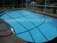 Building Photo - Spacious Home with Luxurious Primary Suite + Den on Oversized Gulf Access Lot!