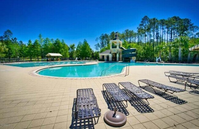 Building Photo - Spacious 3-Bedroom Condo with Pond Views &...