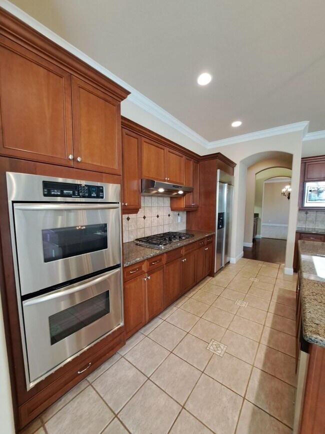 Building Photo - Custom Clovis Residence in Gated Community | Spacious Layout & 3-Car Garage!