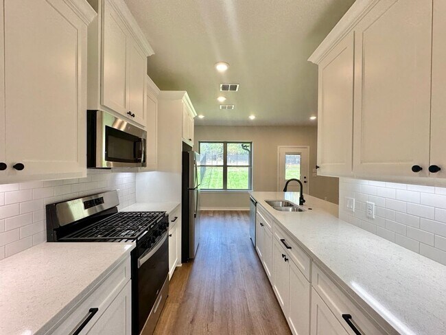 Building Photo - Tour Today! New Construction 4 Bed 2 Bath Triplex!