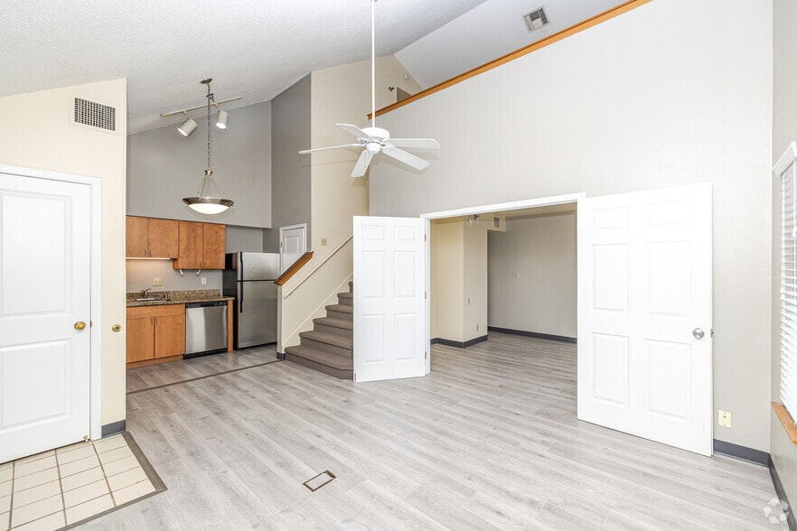 1BR, 2BA + Den - 754SF - Living Room - The Glen Luxury Townhomes