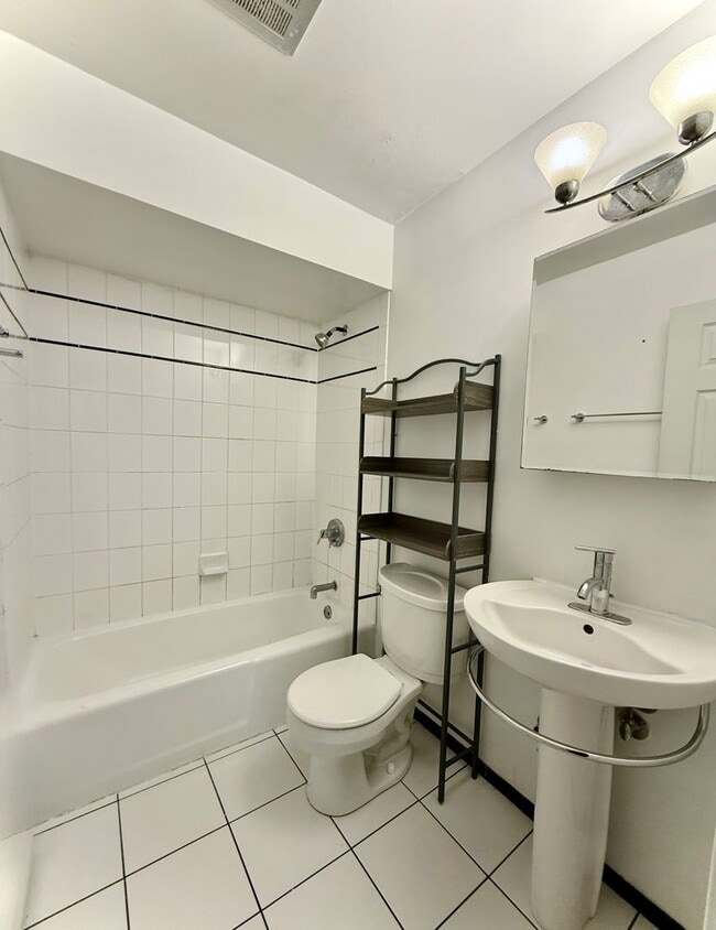 Building Photo - Pristine 2 Bedroom, 1 Bathroom Condo Available NOW! Heat, Water, & Parking INCLUDED in Rent!